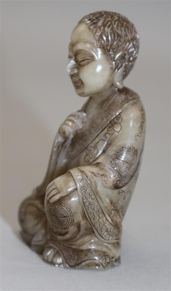 A Chinese soapstone seated figure of Luohan, 8.5cm